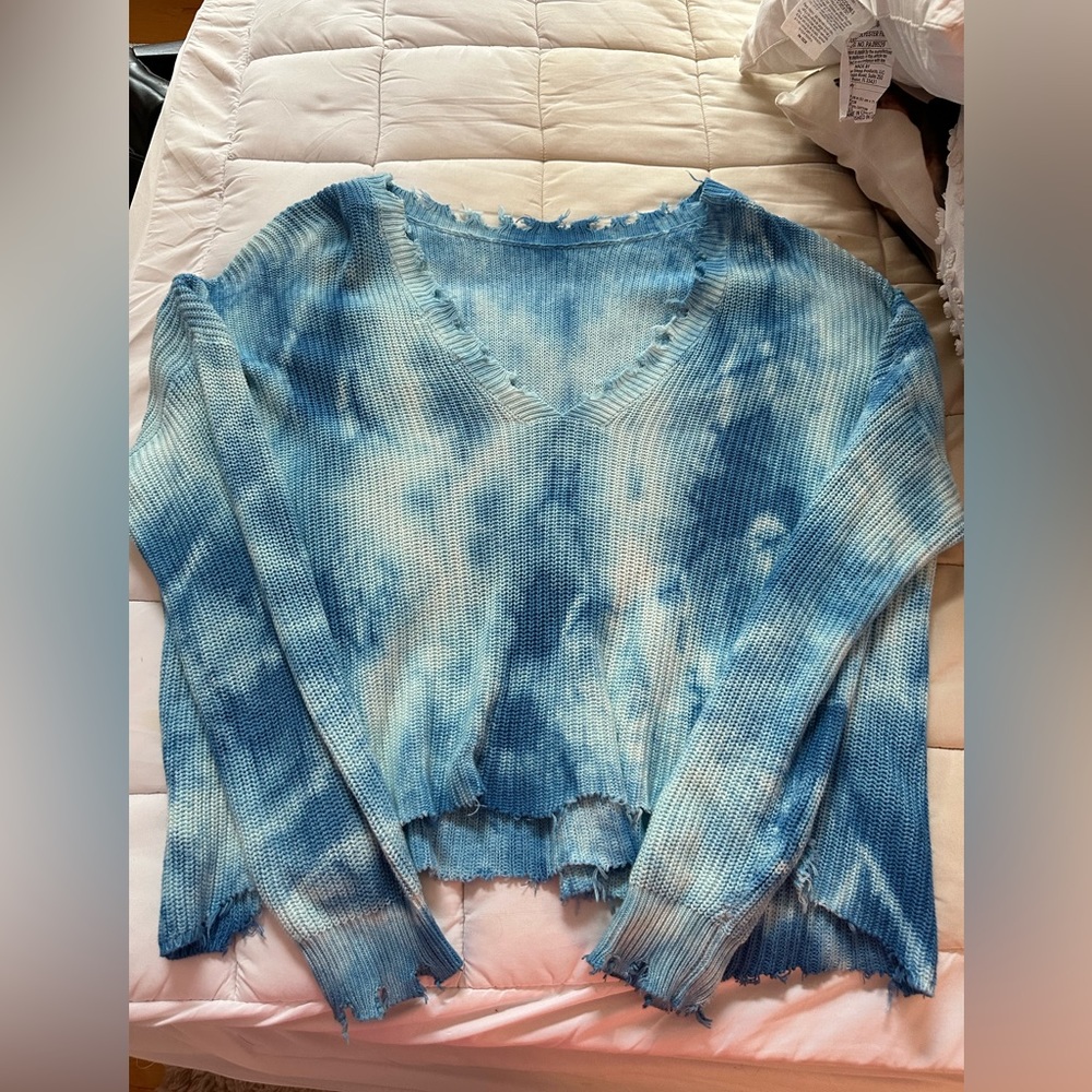 Blue hued off the shoulder sweater from apricot lane